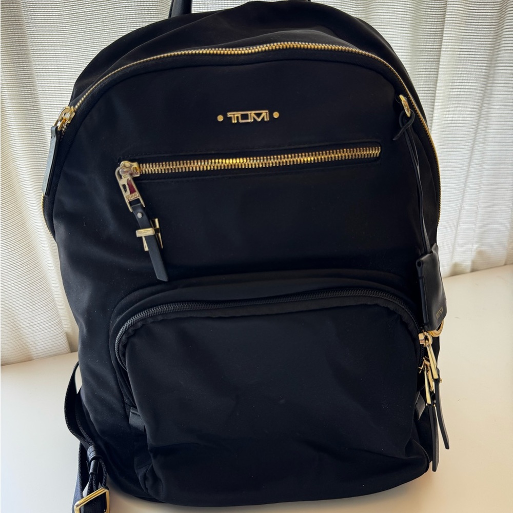 Tumi Harper Black Backpack with gold tone accents